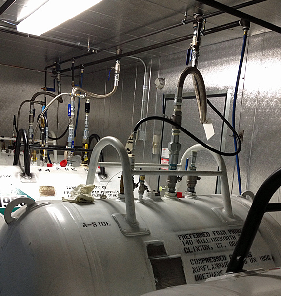 Urethane foam tanks, A and B side shown in a heated tank storage room.